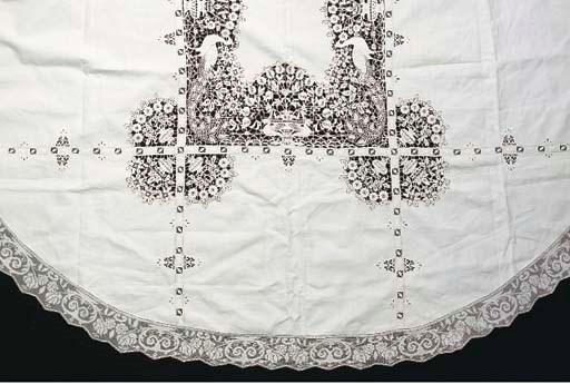 An oval linen tablecloth with needle point insertions, with a filet border, the centre worked with a border of peacocks, Italian, 1890s--274cm long x 198cm
