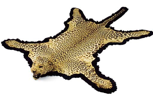 A LEOPARD SKIN RUG