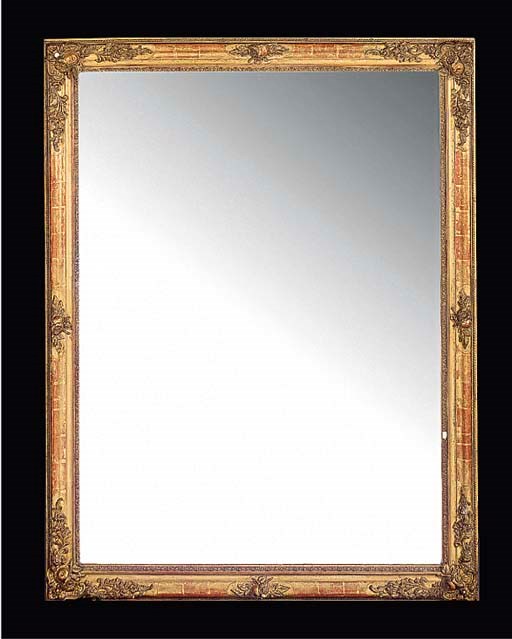 A gilt composition mirror