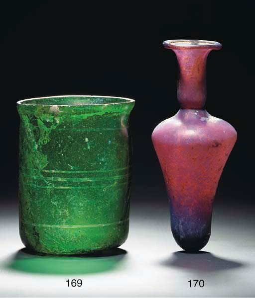 A ROMAN EMERALD GREEN GLASS BEAKER