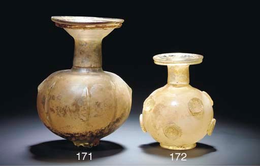 A ROMAN PALE GREEN GLASS SPRINKLER FLASK