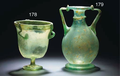 A ROMAN GREEN GLASS STEMMED BEAKER OR HANGING LAMP