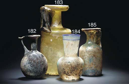 A ROMAN IRIDESCENT PALE GREEN GLASS JUG