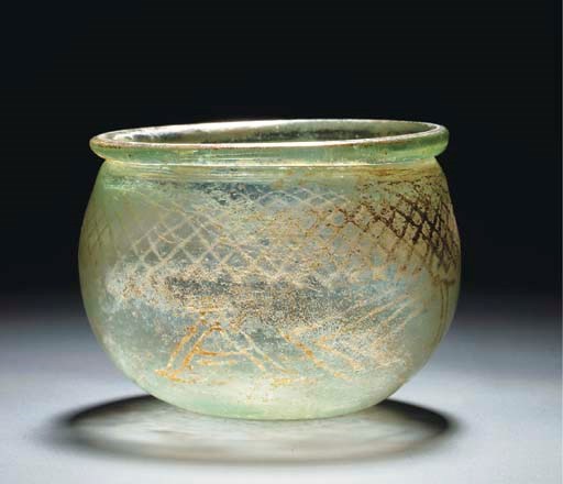 A LATE ROMAN GREEN GLASS INSCRIBED BOWL