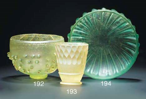 A ROMAN FACET-CUT PALE GREEN GLASS BEAKER