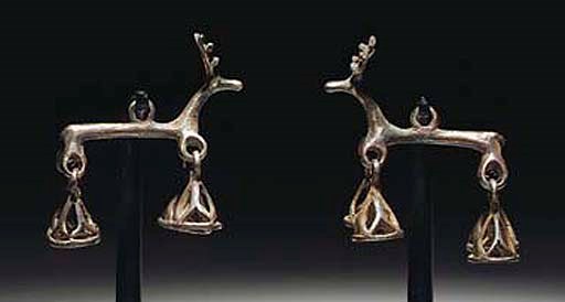 TWO PERSIAN SILVER STAG PENDANTS