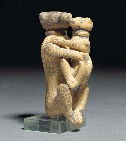 AN ETRUSCO-CORINTHIAN TERRACOTTA MOTHER AND BABY MONKEY FLASK