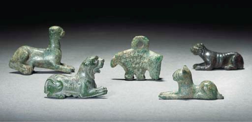 A GREEK BRONZE BOAR AMULET