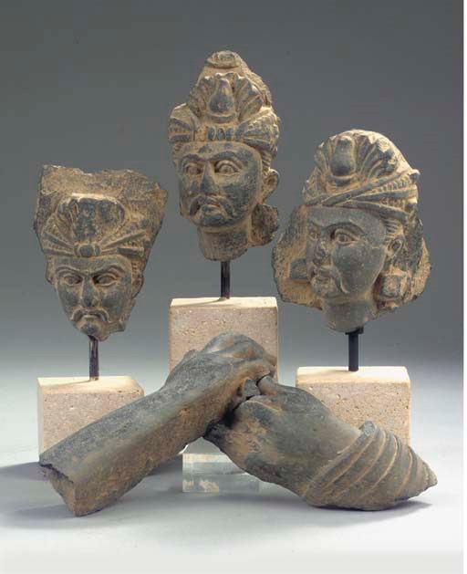 Three Gandhara grey schist adorant heads