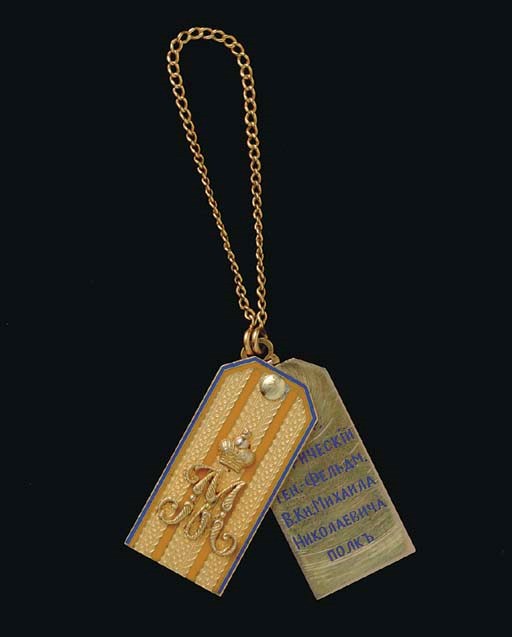 A GOLD AND ENAMEL JETTON DEPICTING A SHOULDER BOARD