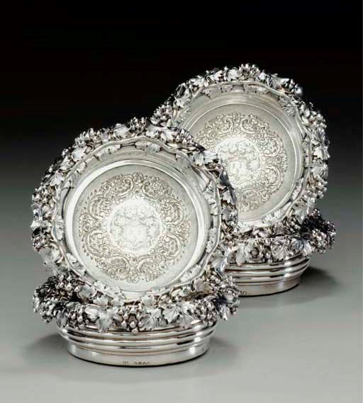 A SET OF FOUR GEORGE IV SILVER WINE COASTERS