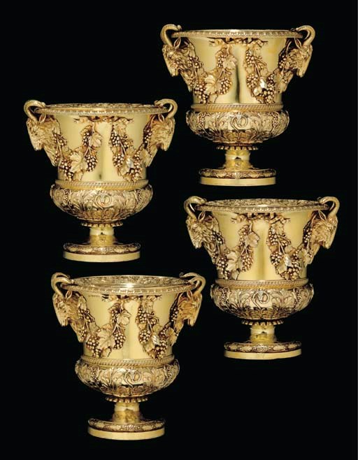 A MAGNIFICENT SET OF FOUR REGENCY SILVER-GILT WINE COOLERS