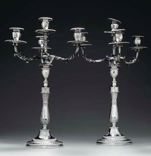 A PAIR OF GEORGE IV/VICTORIAN SILVER FOUR-LIGHT CANDELABRA