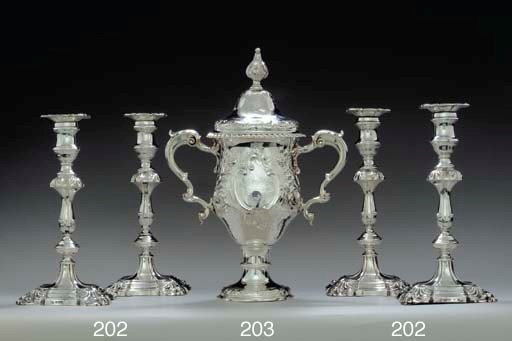 A SET OF FOUR VICTORIAN SILVER CANDLESTICKS