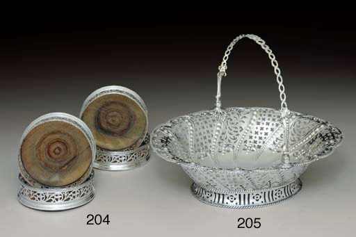 A SET OF FOUR GEORGE III SILVER WINE COASTERS