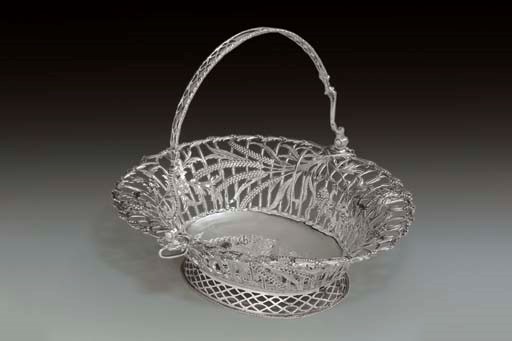 A GEORGE III SILVER CAKE BASKET