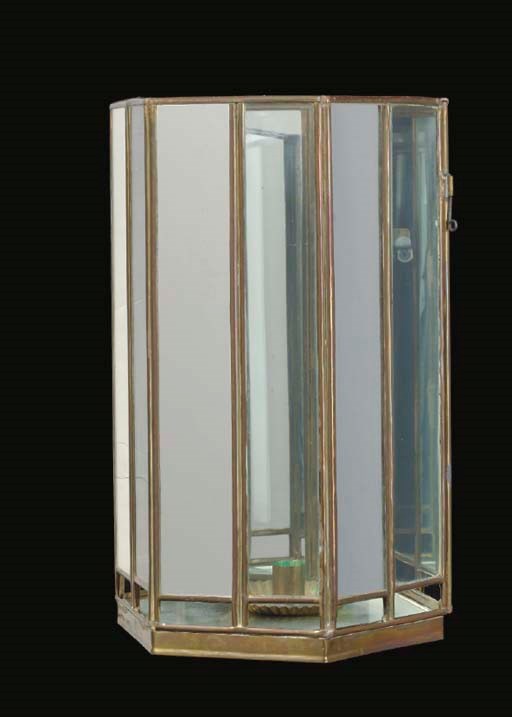 A PAIR OF METAL, GLASS AND MIRROR-PANELED WALL LIGHTS TOGETHER WITH A PAIR OF BRASS CANDLESTANDS,