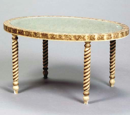 A LOUIS XVI STYLE PARCEL-GILT AND FAUX SNAKESKIN OVAL COFFEE TABLE,