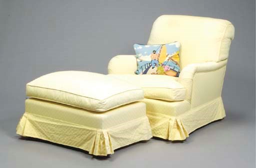 A CONTEMPORARY UPHOLSTERED CLUB CHAIR AND OTTOMAN,