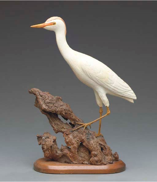 A CARVED AND POLYCHROME-PAINTED FIGURAL GROUP OF BIRDS ON RESIN-COVERED ROCK, SHELL AND UNDERWATER PLANTLIFE BASE,
