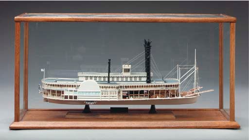 A CARVED POLYCHROME DECORATED WOODEN MODEL OF THE PADDLE BOAT 'THE ROBERT E LEE',