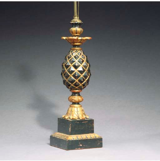 A PAIR OF CARVED AND EBONIZED PARCEL-GILT FINIAL-FORM TABLE LAMPS,