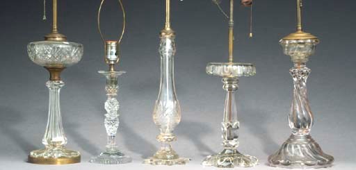 A GROUP OF NINE MOULDED AND CUT-GLASS TABLE LAMPS,