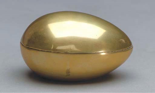 A BRASS EGG-FORM BONBONNIERE,