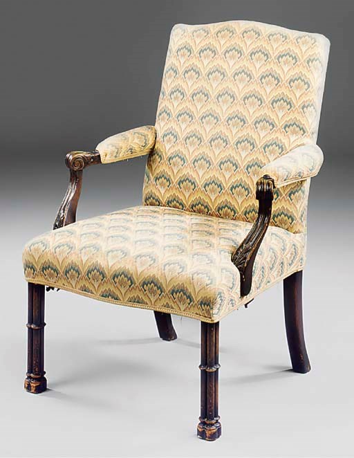A mahogany and upholstered open armchair