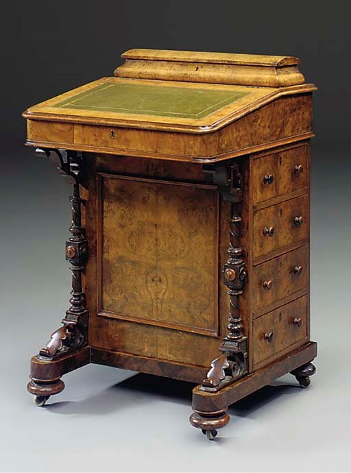 A VICTORIAN BURR WALNUT DAVENPORT