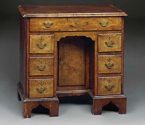 A GEORGE I WALNUT KNEEHOLE DESK