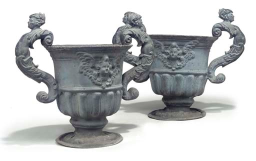 A ENGLISH PAIR OF LEAD URNS