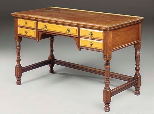 A VICTORIAN MAHOGANY AND SATINWOOD WRITING TABLE