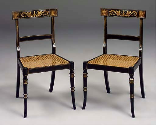 A SET OF SIX EBONISED AND GILT-DECORATED DINING CHAIRS