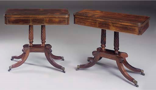 A pair of Regency rosewood and brass inlaid card tables