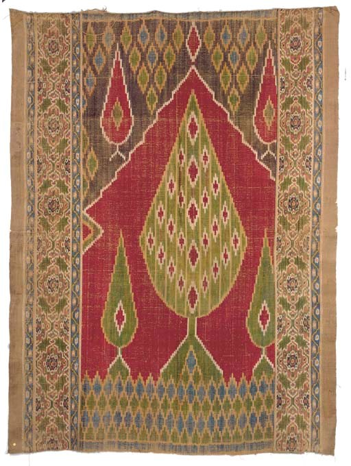 A silk velvet prayer-hanging, woven with a green and red stylised cypress tree flanked by smaller trees beneath a mehrab arch, the lateral borders woven with medallions--58 x 42½in. (148 x 108cm.), Kashan, Persia, 19th century
