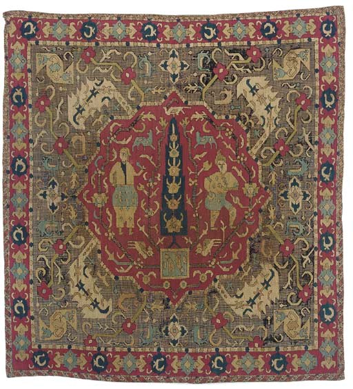 A figurative embroidered bocha, surface darned in silks, the central medallion enclosing two figures in Safavid style dress within a stylised garden, the field with small birds amidst curving flowering branches, with a lozenge border in-filled with bird motifs--31¼ x 29¾in. (79 x 75.5cm.), Caucasian, 17th century, black silks corroded to reveal a blue and ivory checked cotton ground, some repairs