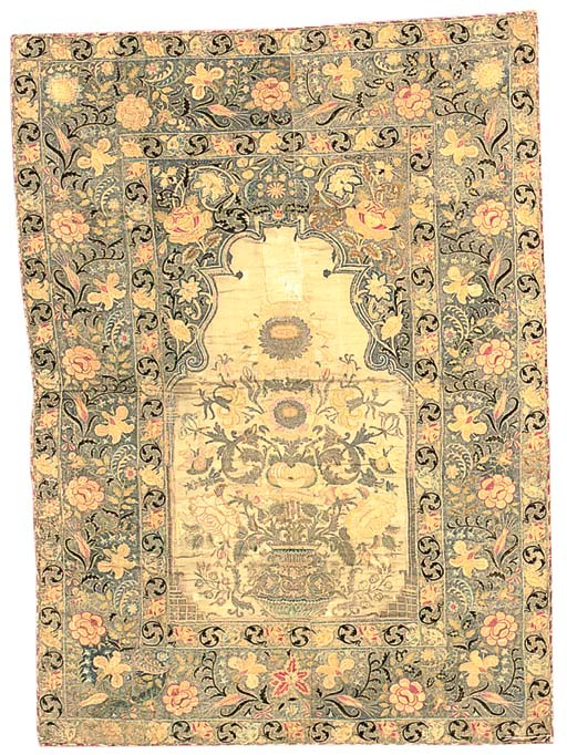 An embroidered prayer-hanging, the wool ground finely tamboured in silks and metal thread with an urn of flowers beneath a mehrab arch of delicate flowering vines bearing exotic blooms--70 x 51in. (180 x 130cm.), Ottoman, 18th century, some losses to wool ground, metal tarnished