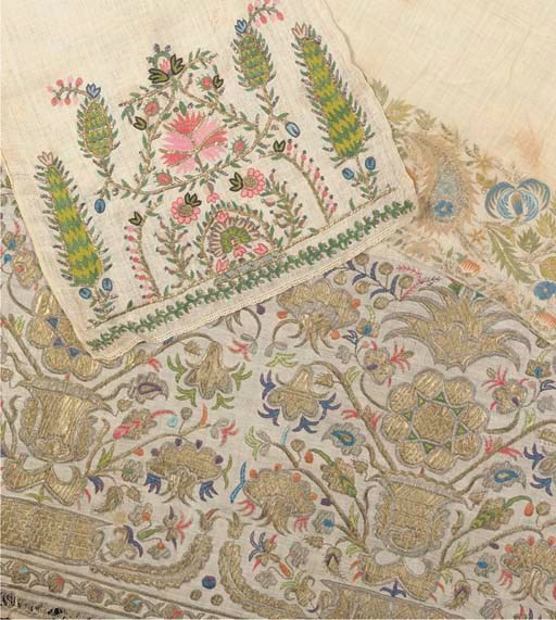 A fine bath towel of striped linen, embroidered with a deep border composed of gilt urns with large flowering shrubs, Ottoman, possibly Greek Island, 19th century-92cm x 150cm