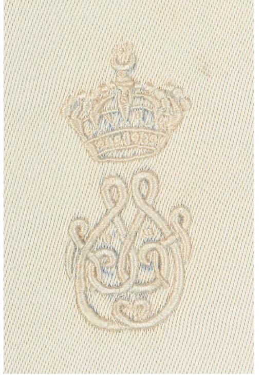 A table cloth and eight matching ivory damask napkins, woven with an acanthus leaf design, monogrammed NF for King Faroukh of Egypt, with embroidered inscription in the seam allowance Ruk'h Faroukh-the cloth 2324cm x 160cm, the napkins 55cm square