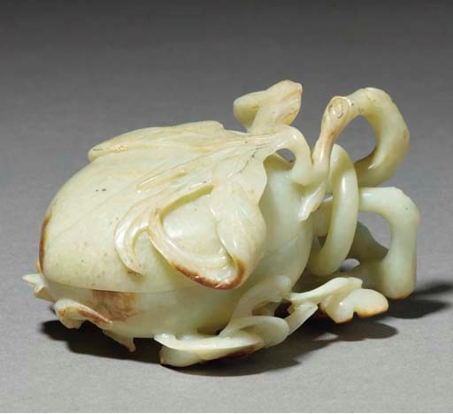 A Chinese celadon and russet jade peach form box and cover, 19th/20th century