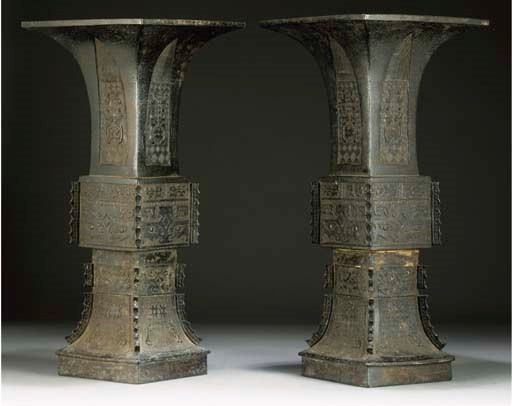A pair of Chinese bronze gu vases, Ming Dynasty