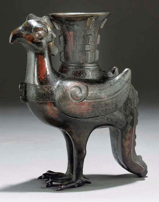 A Chinese patinated archaic style bronze model of a phoenix, 17th Century