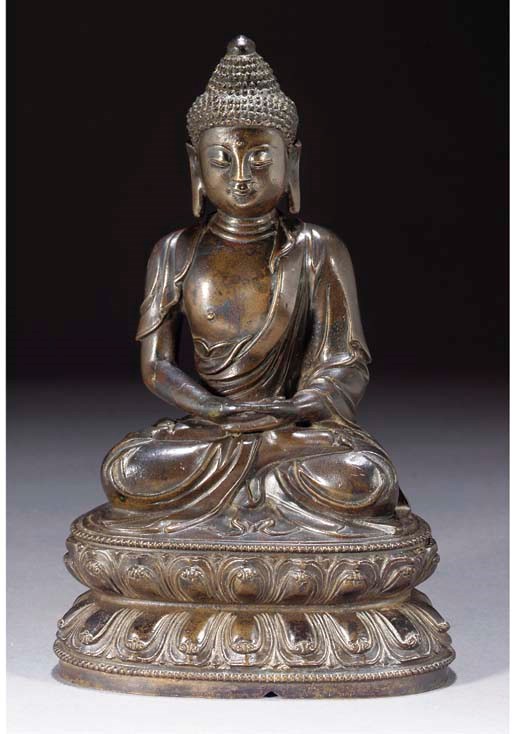 A Chinese bronze model of Buddha, 16th/17th century