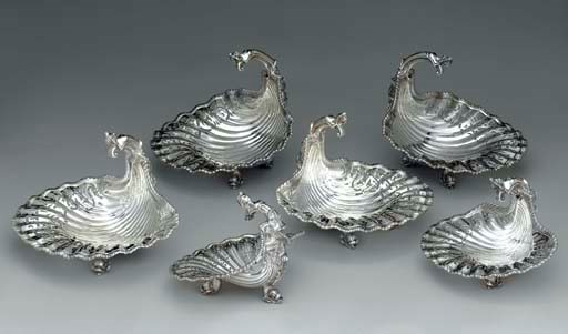 A SET OF SIX SILVER SHELL-FORM BASKETS