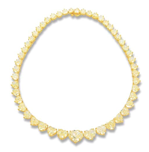 AN IMPORTANT YELLOW DIAMOND RIVIERE