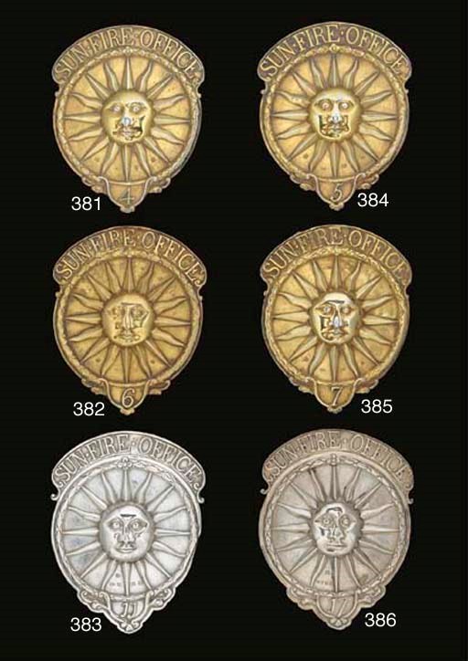A GEORGE III SILVER-GILT SUN FIRE OFFICE FIREMAN'S ARM BADGE NUMBER 7