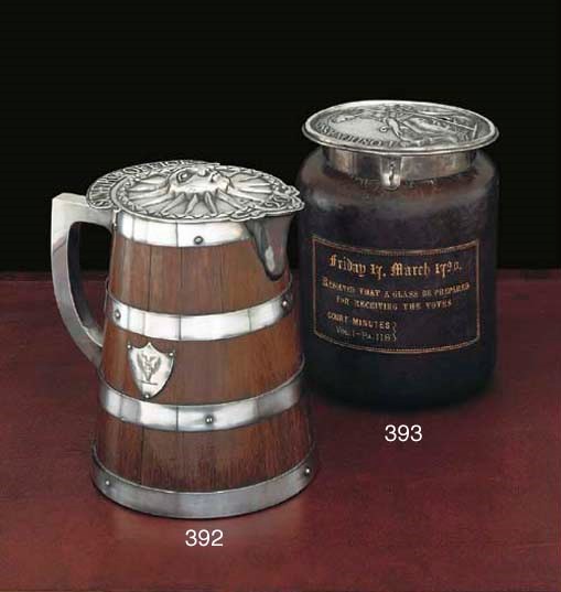 A GEORGE III SILVER LONDON ASSURANCE FIREMAN'S ARM BADGE NUMBER 9 MOUNTED AS A BALLOT BOX