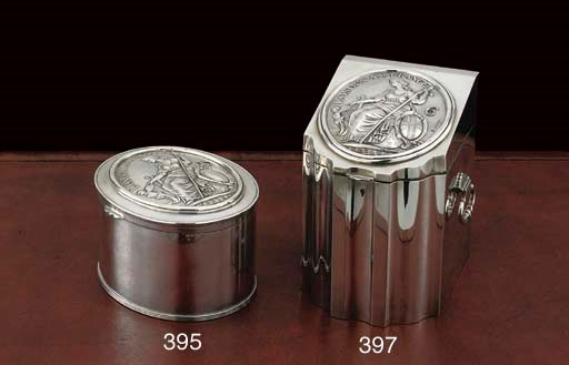 A GEORGE III SILVER LONDON ASSURANCE FIREMAN'S ARM BADGE NUMBER 15 MOUNTED AS A BISCUIT BOX