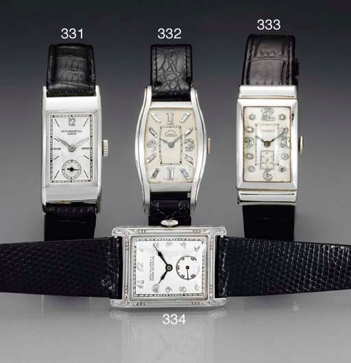 LONGINES. A 14K WHITE GOLD AND DIAMOND-SET RECTANGULAR WRISTWATCH
